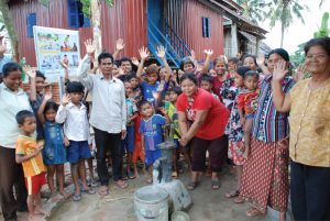 People at Water Pump: Lotus Outreach International